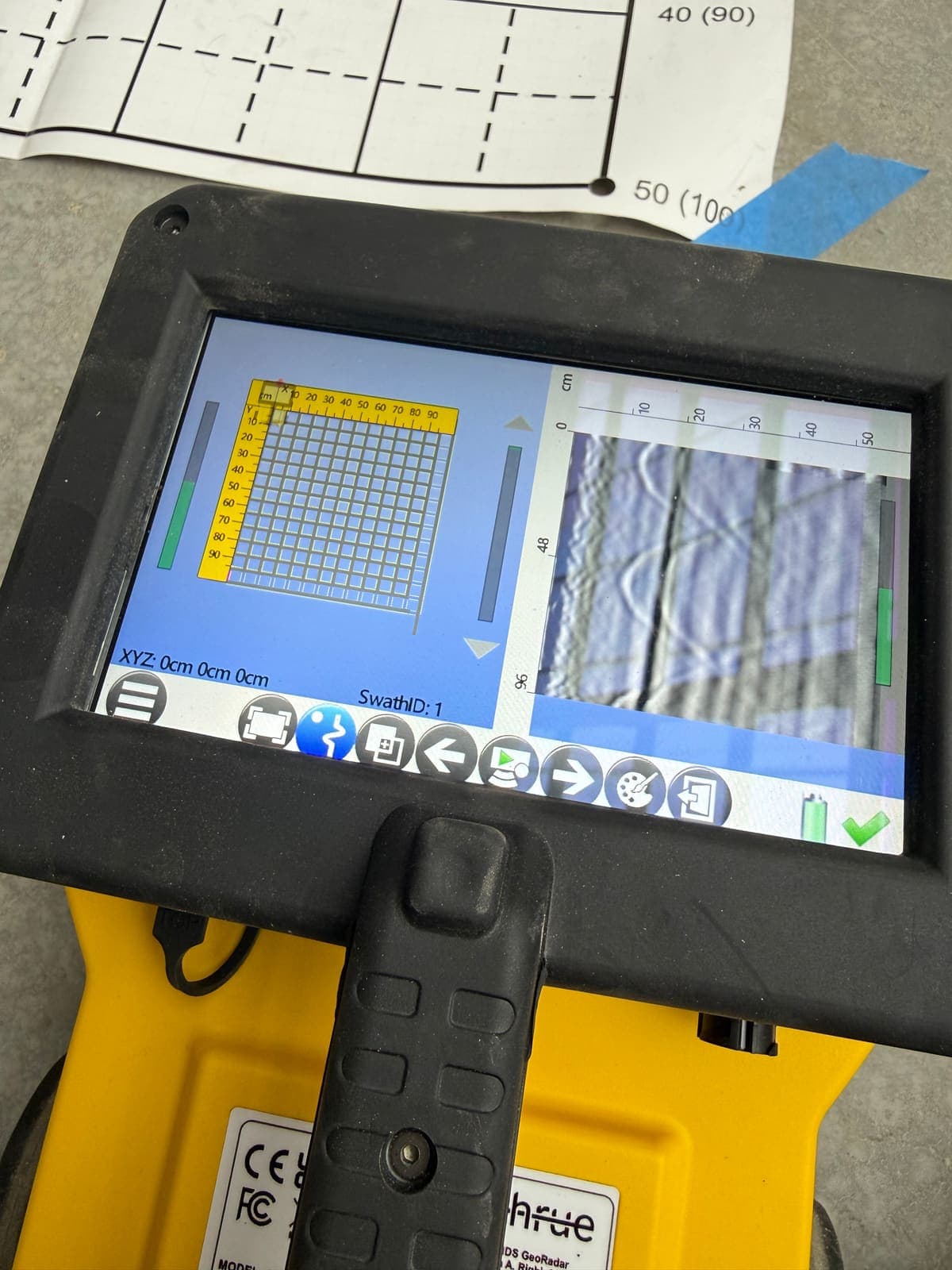 Concrete scanner display showing rebar reflections inside the slab during a scan