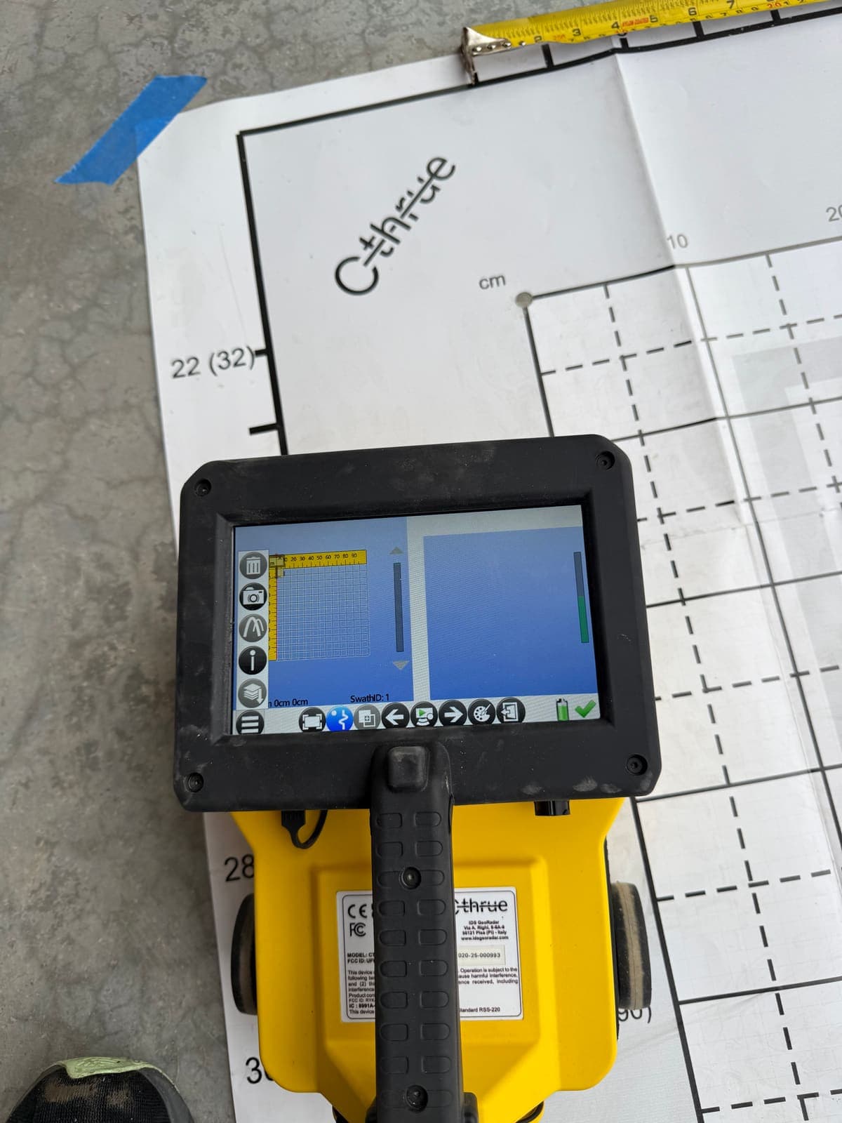 Setting up the concrete scan grid with the GPR scanner before coring