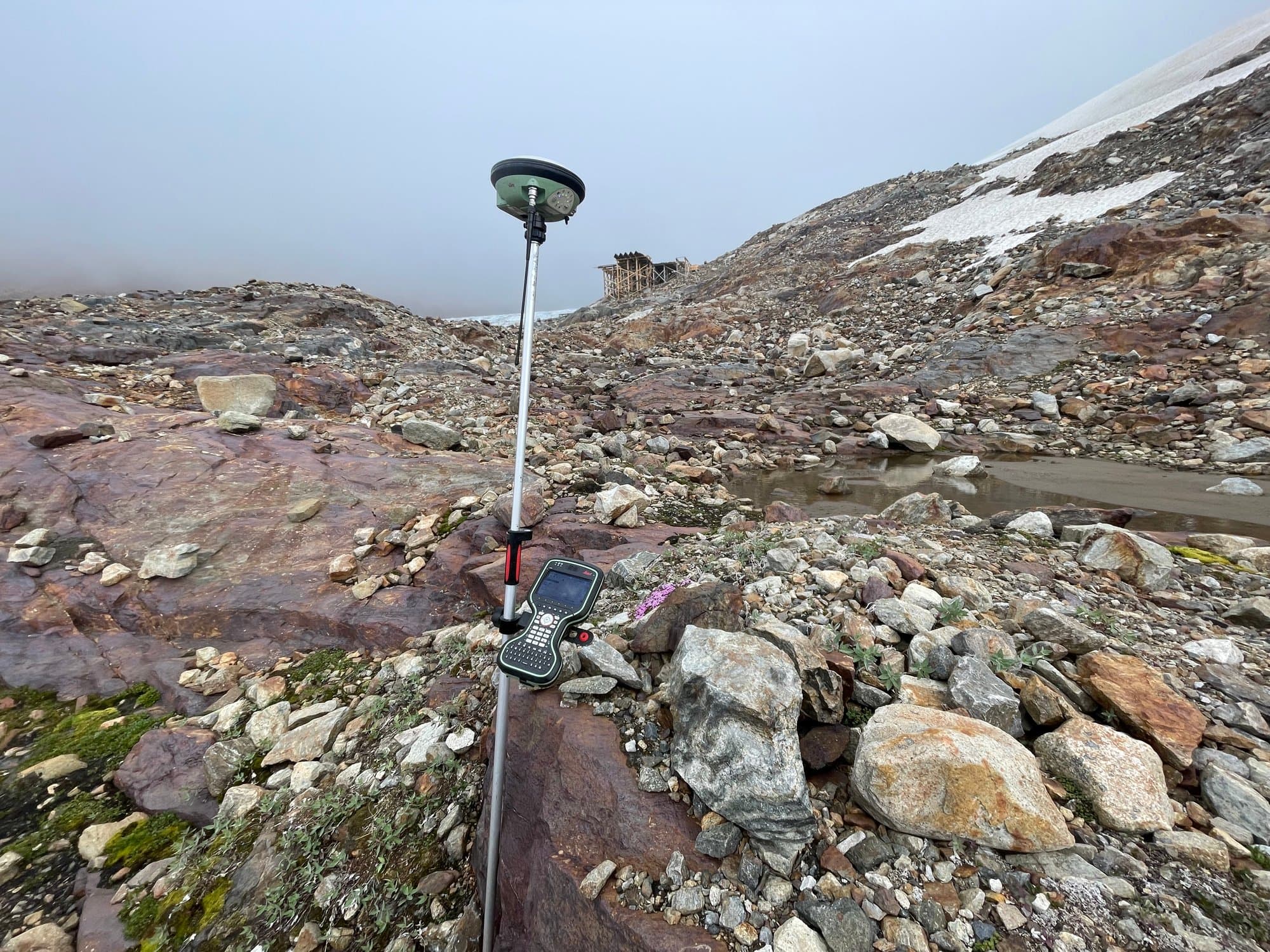 GNSS pole planted in alpine talus