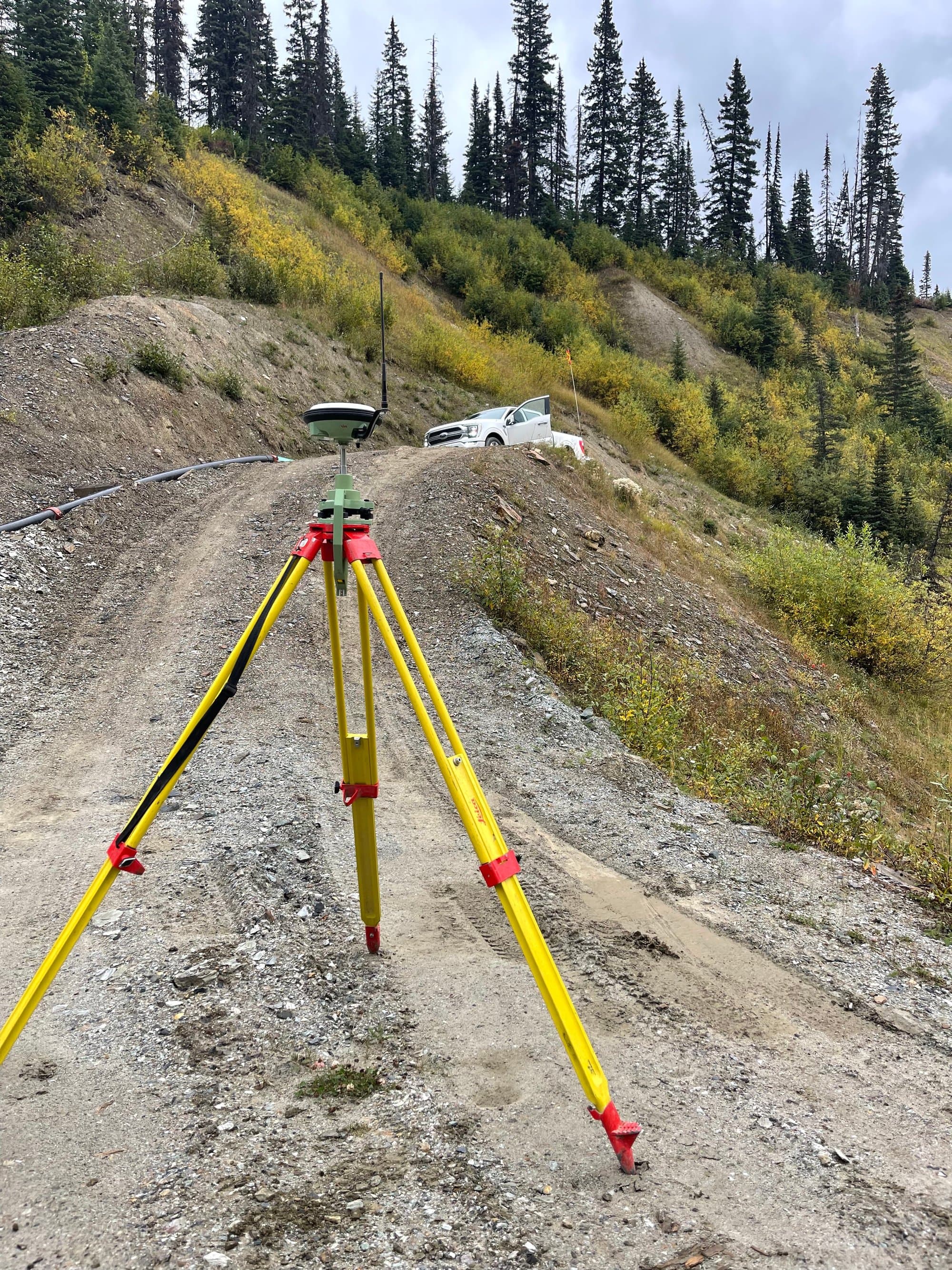 Survey tripod above mine switchback roads