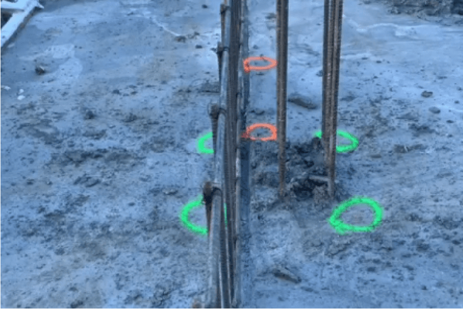 Layout markings for wall faces and column corners on a BC site