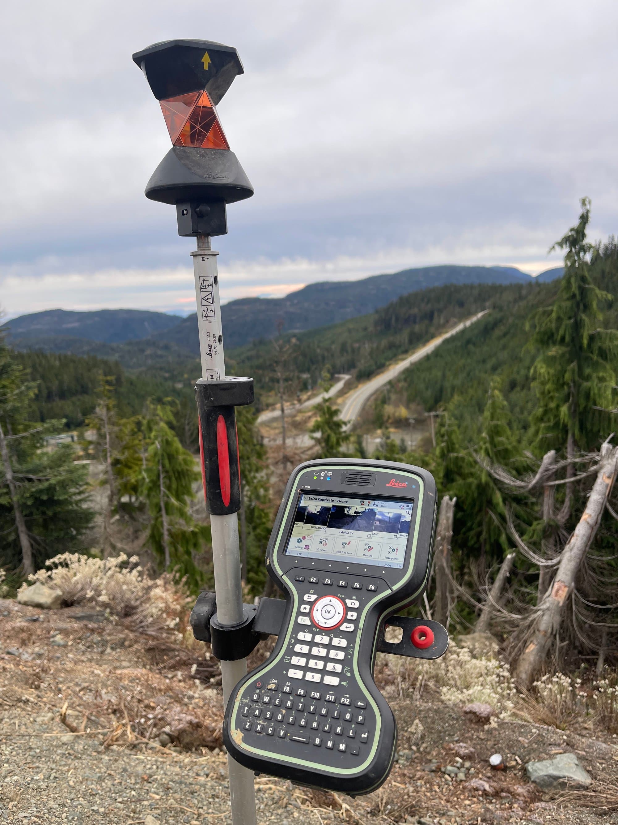 GNSS controller overlooking a mountain highway