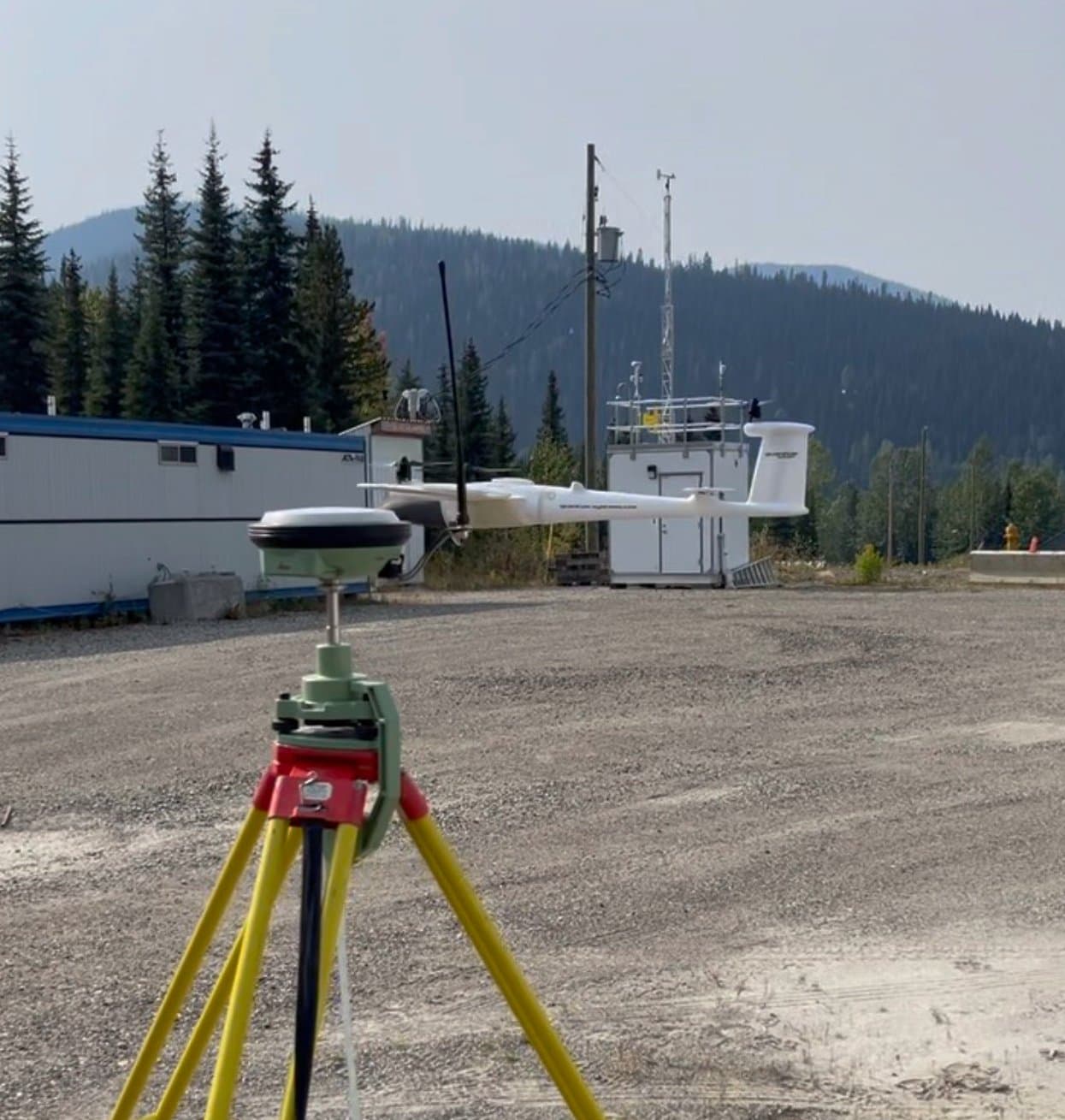 GNSS base at a remote camp below the mountains