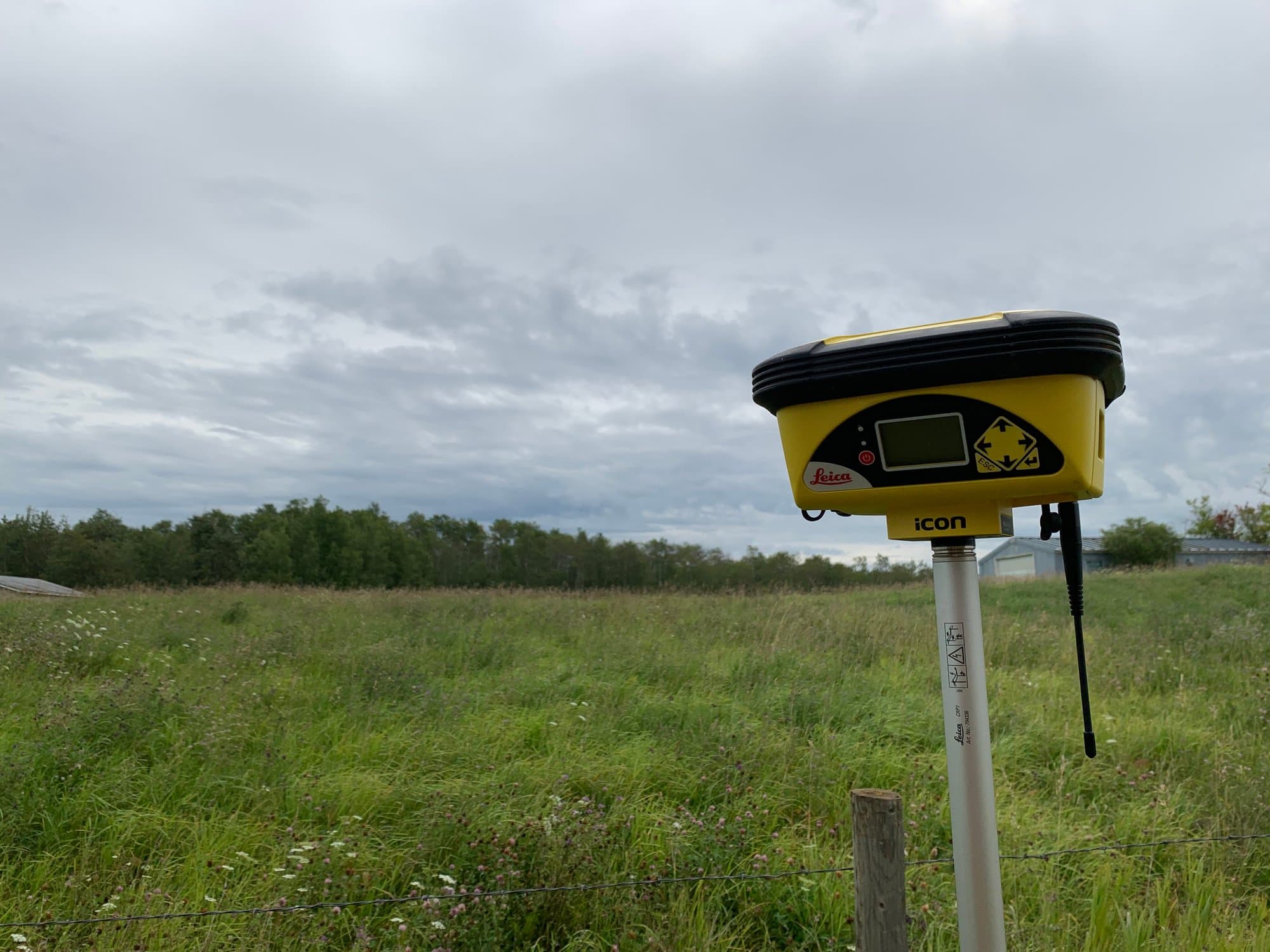 GNSS smart antenna on a meadow site
