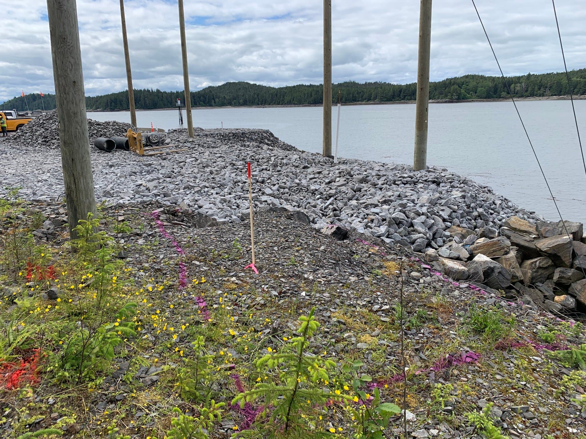 Shoreline riprap staking along a lake