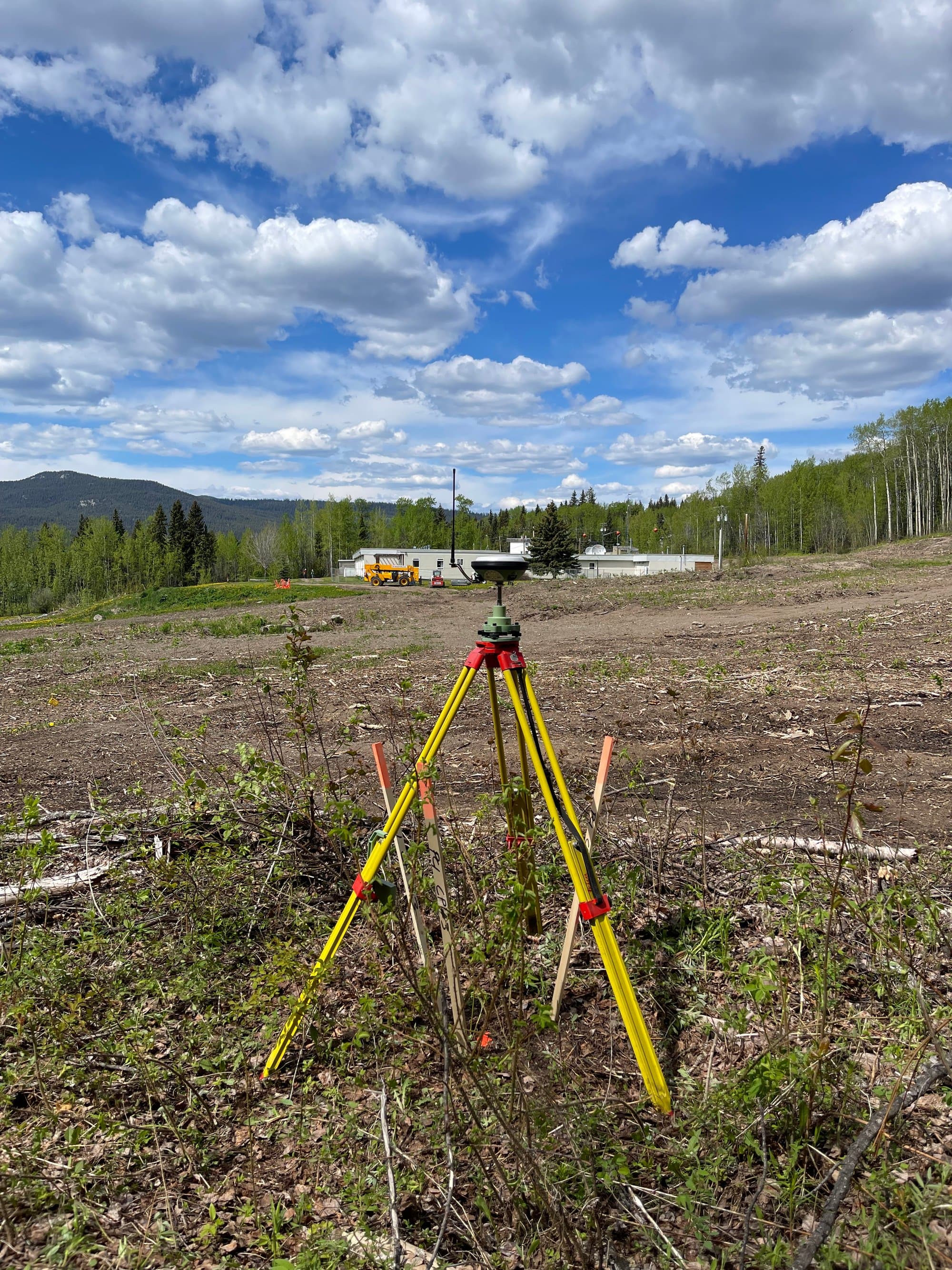 Cleared lot survey with mountains behind