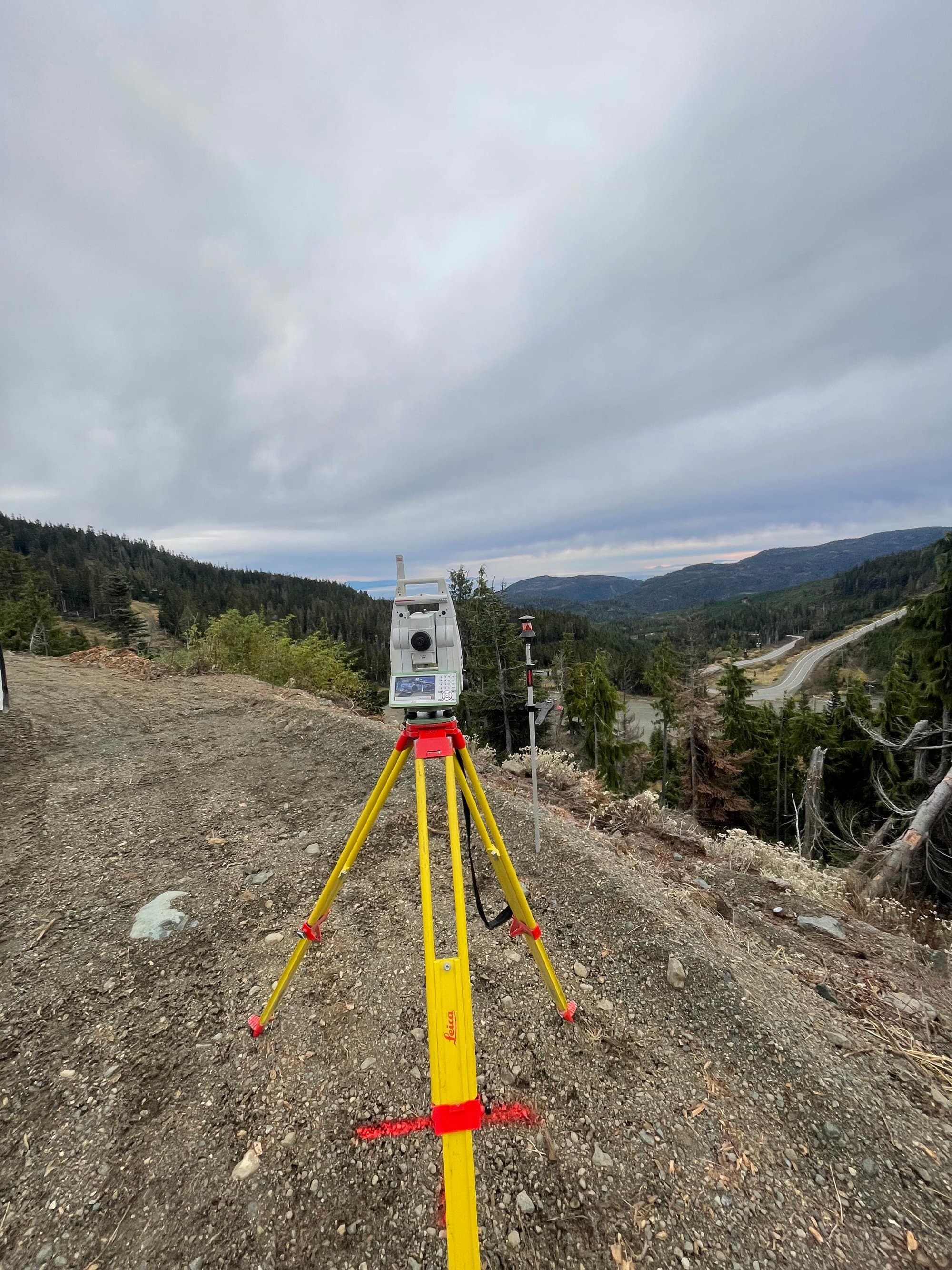 Total station set up on a forest logging road