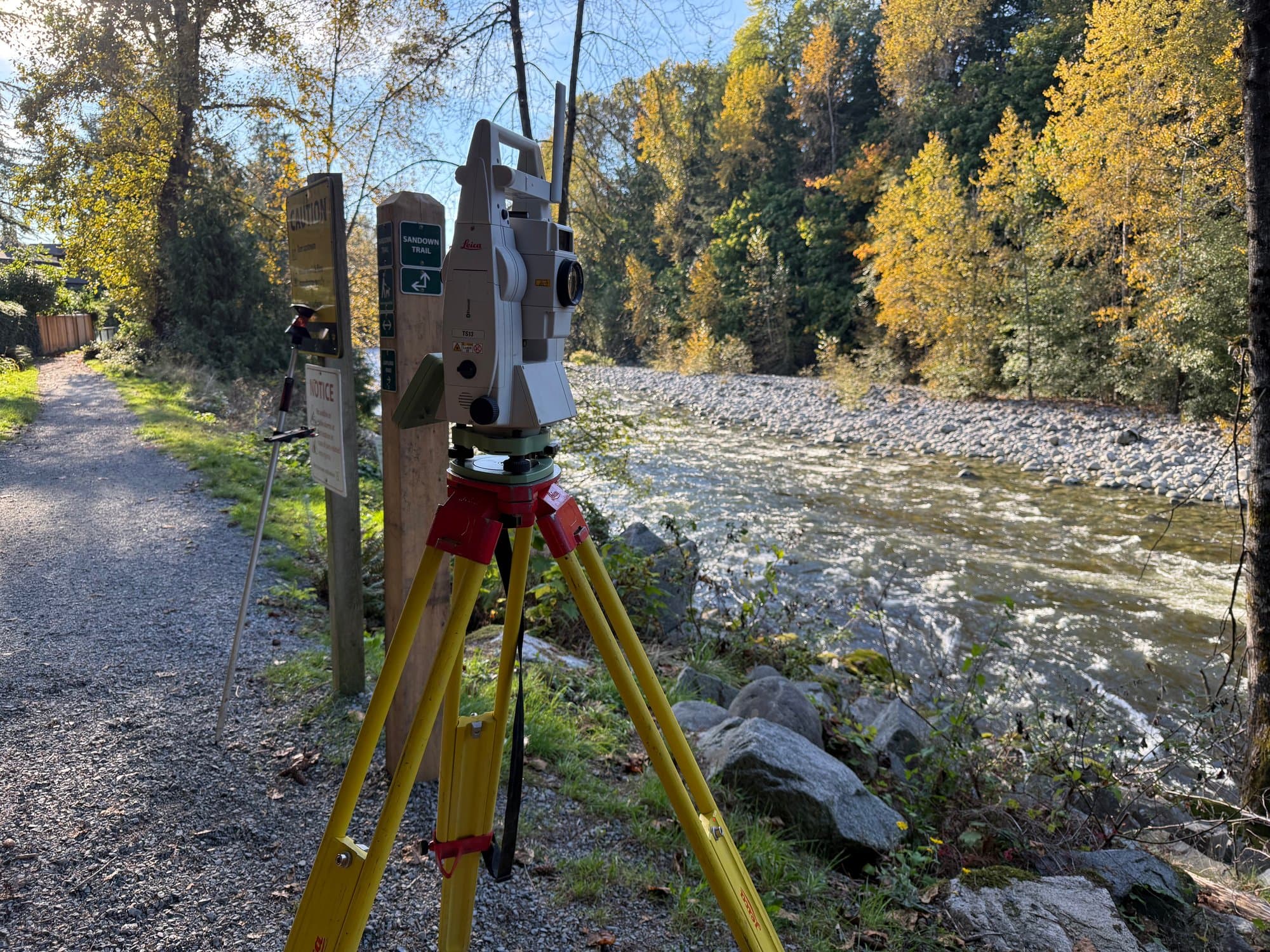 Total station on a river gravel bar during a channel survey