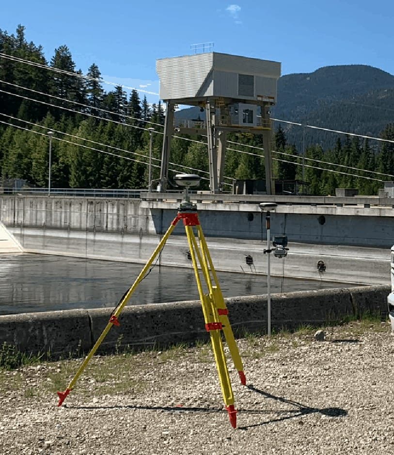 Survey tripod at a dam forebay