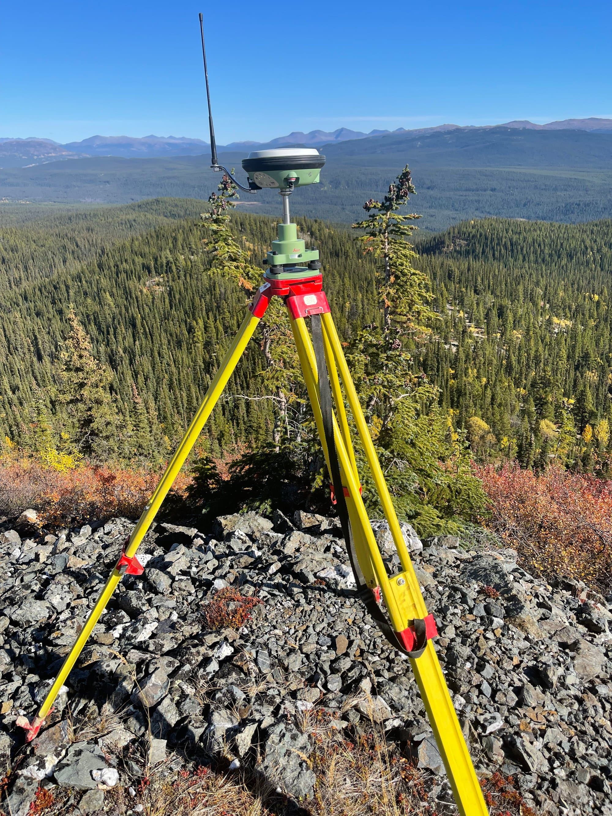 Tripod against mountain fall colours