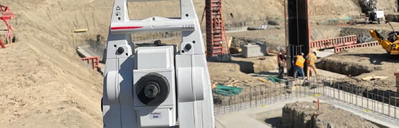 Survey equipment on a commercial construction site in Vancouver for layout and grade verification.