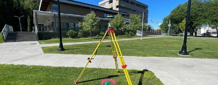 Survey equipment outside Prince George City Hall for surveying and private utility locating.