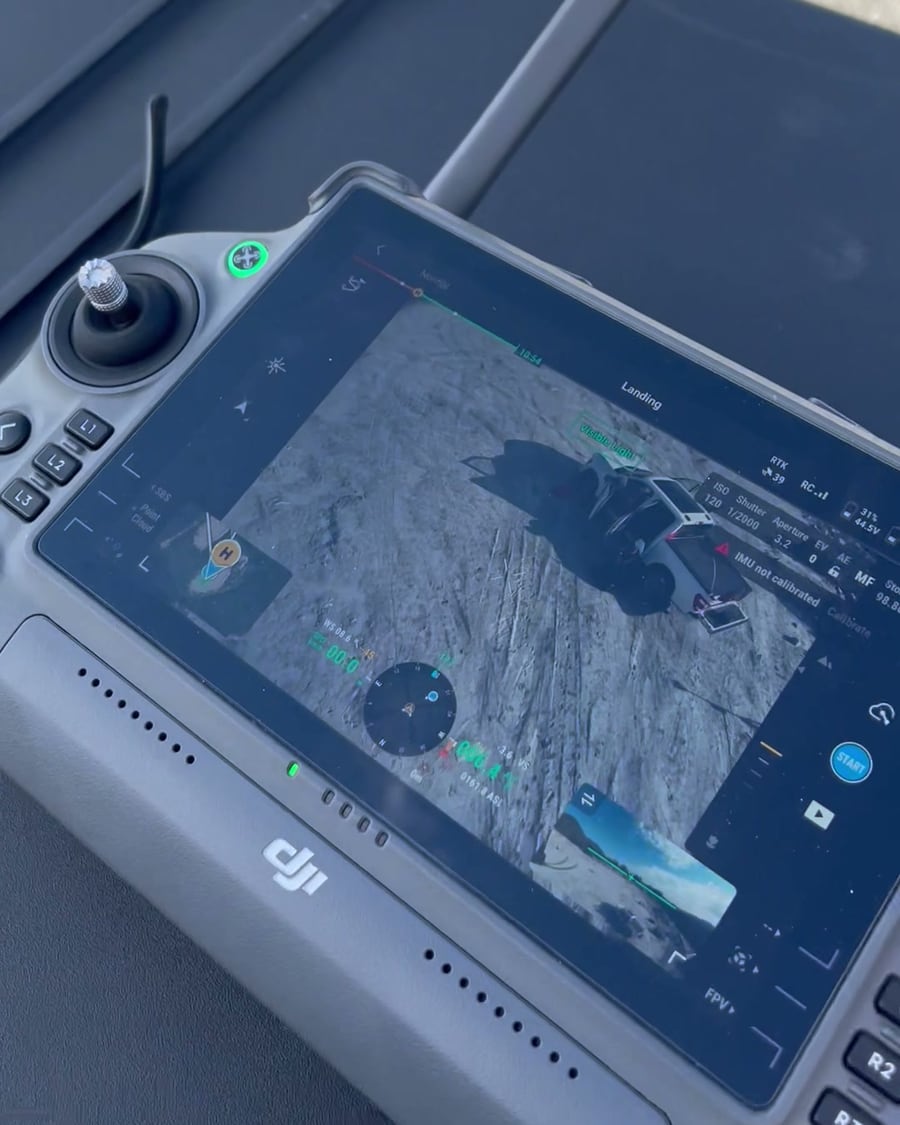 Survey drone controller showing the live camera view and flight data as the aircraft lands