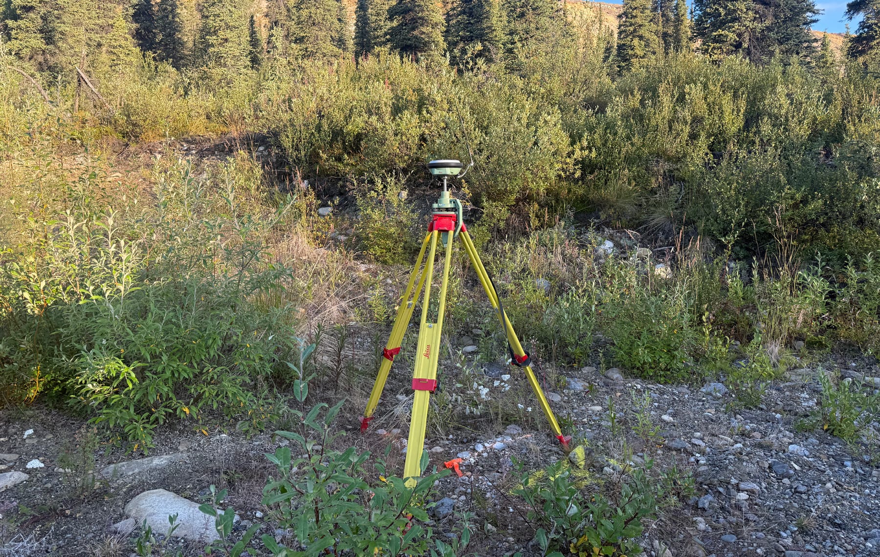 GNSS base station set on control at a remote construction site in northwest British Columbia