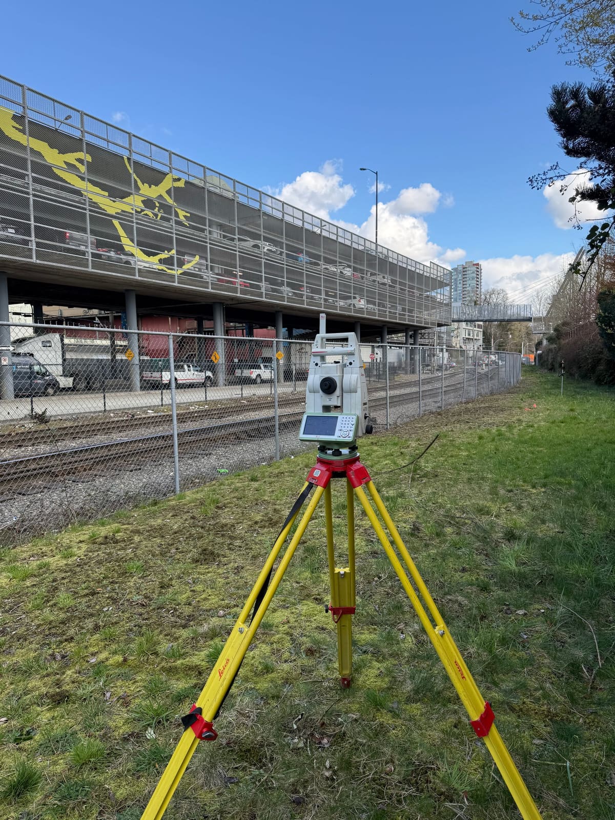 Total station set up beneath an elevated transit guideway on an infrastructure site
