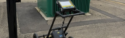 Locating a waterline using ground penetrating radar on a site under construction.