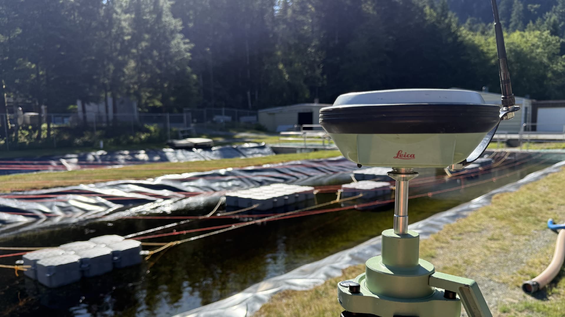 We are your local surveyor near Edmonton, Prince George, Whitehorse and Alberta. In this image we are setup with our high precision GNSS base receiver to survey a commercial construction project in BC.