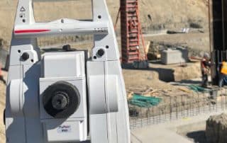 Survey equipment on a commercial construction site in Vancouver for layout and grade verification.