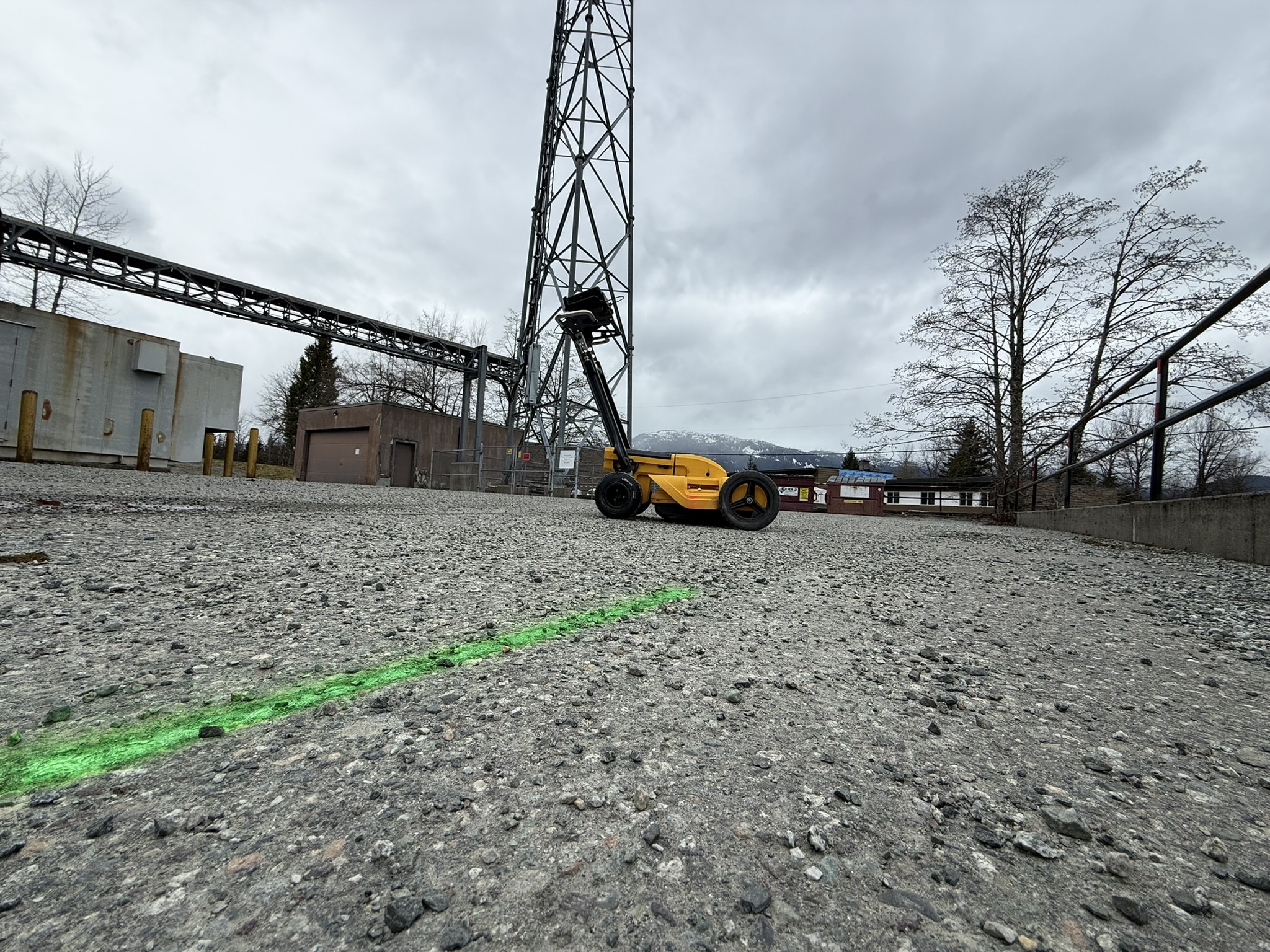 Private utility locating markings on a construction site before excavation, drilling, and ground disturbance in Western Canada.