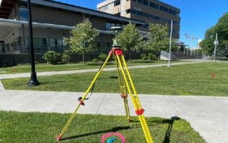 Survey equipment outside Prince George City Hall for surveying and private utility locating.