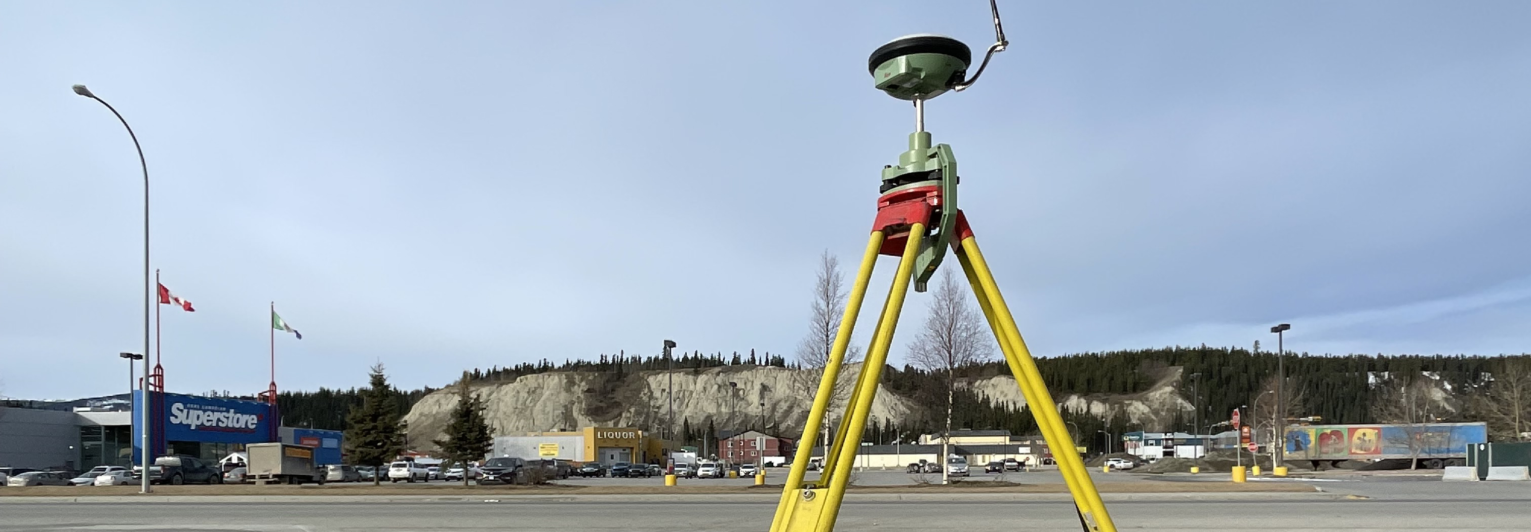 Survey GPS rover set up for topographic surveying on a commercial site in Whitehorse, Yukon